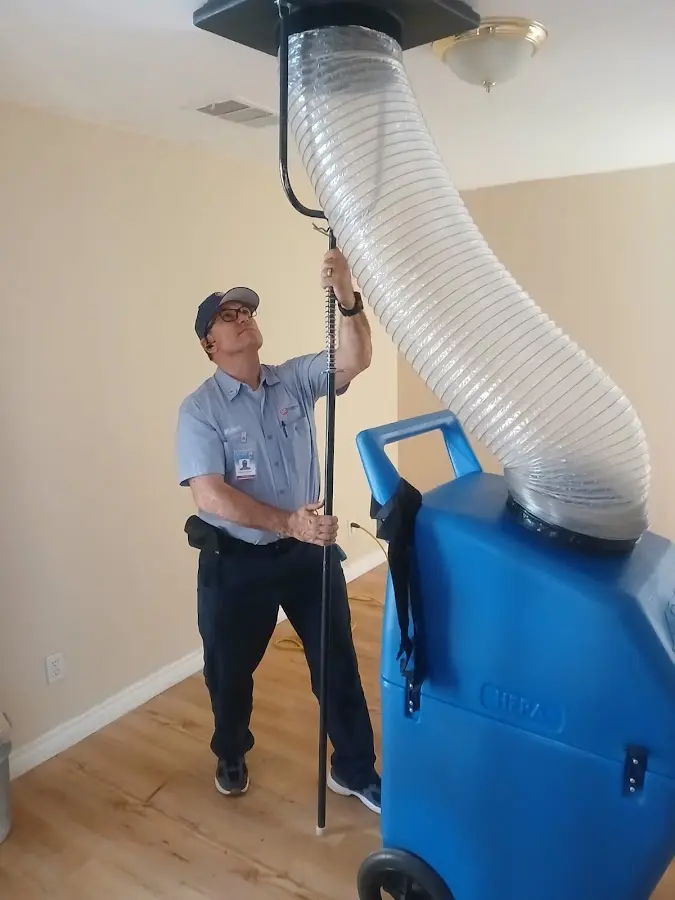Furnace Tune-Up technician using HEPA equipment in Round Rock